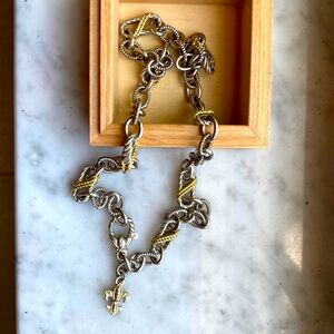 Judith Ripka sterling silver with gold accents.  Fleur de lis chain